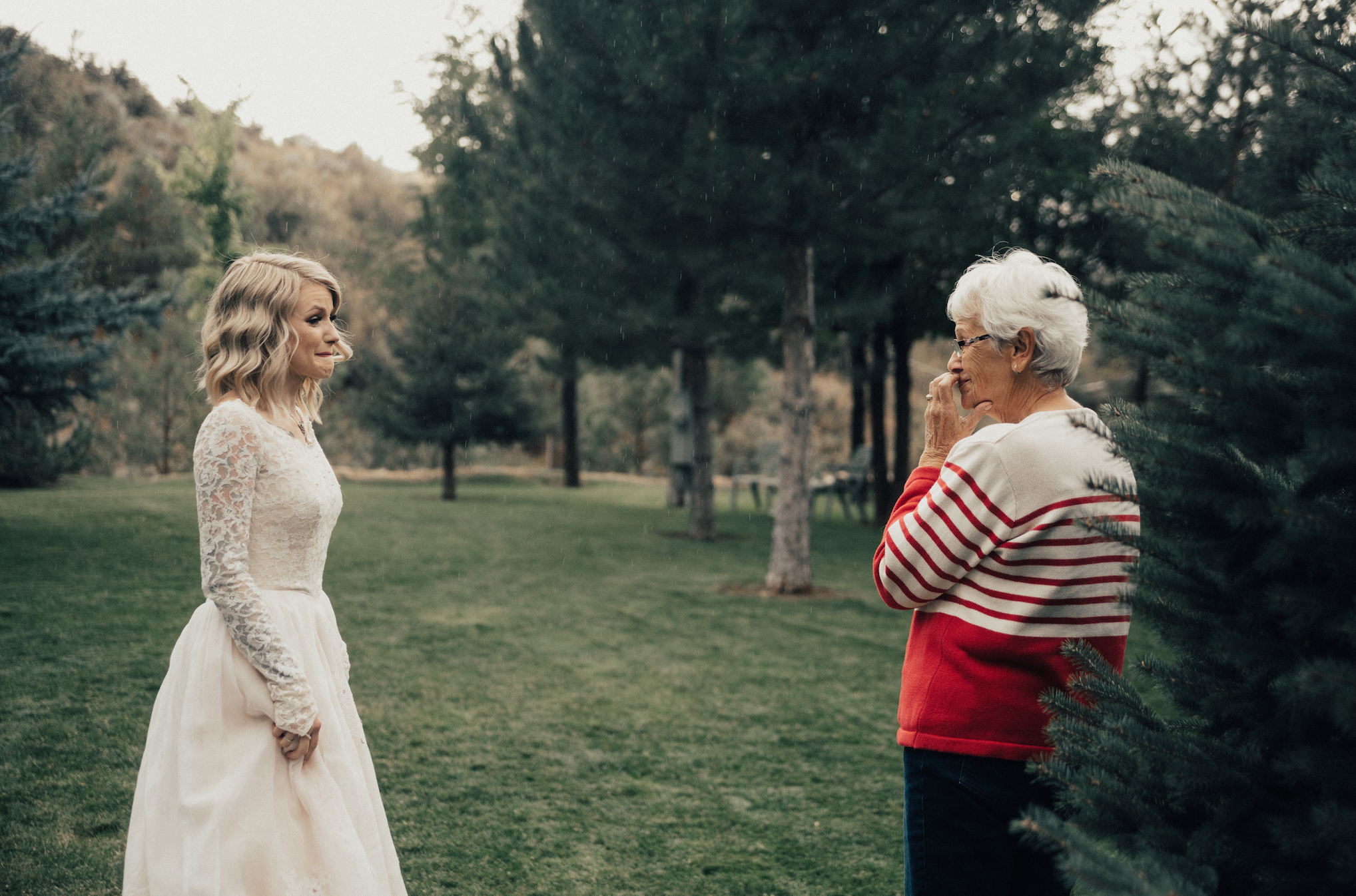Free Photo | Grandmother in elegant dress looking after grandchild
